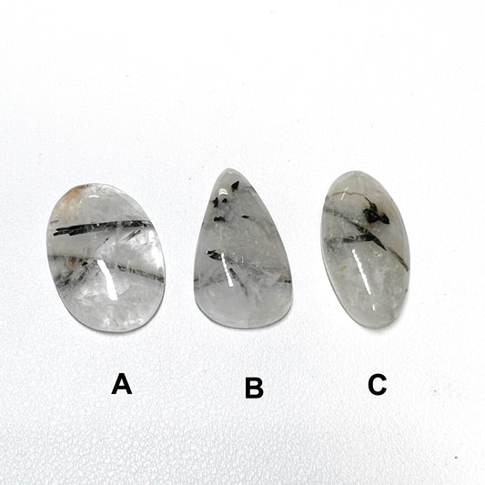 Black Rutile Quartz Cabochons Drilled from Madagascar